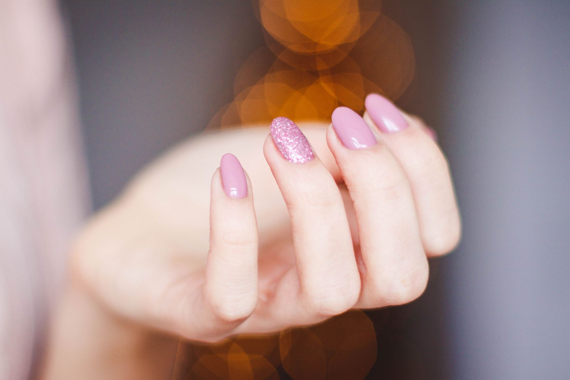 Pink manicure in warm light